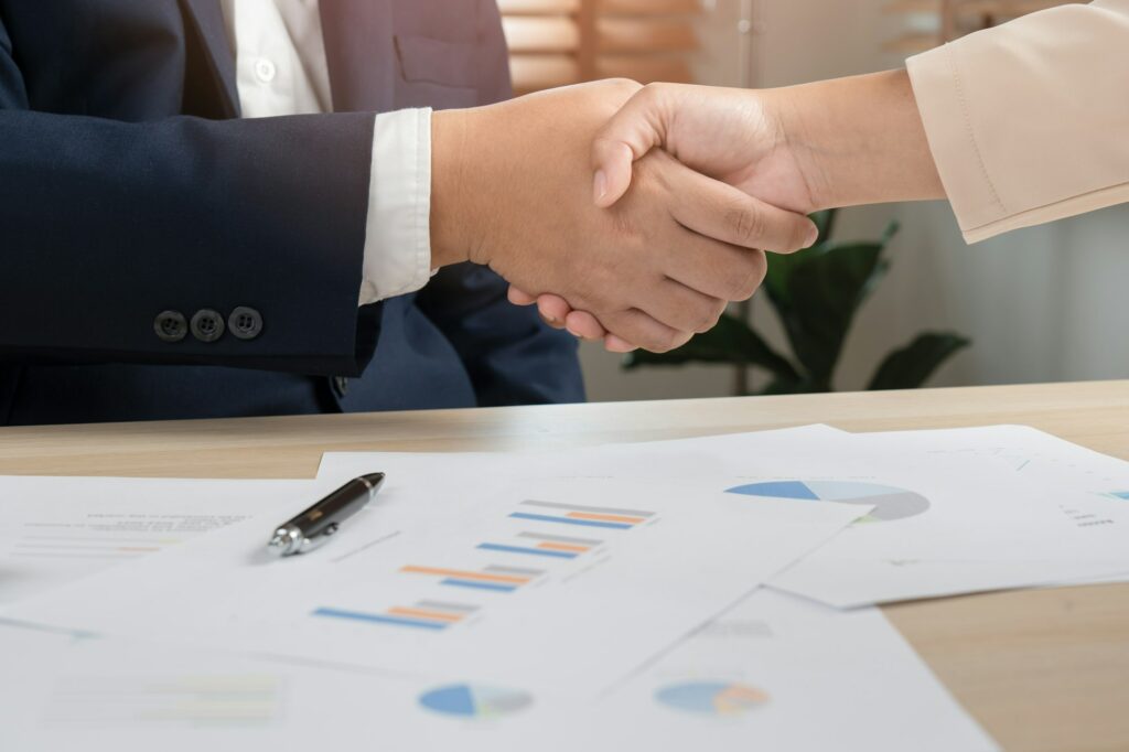 Business man and woman do handshaking agreement contact success